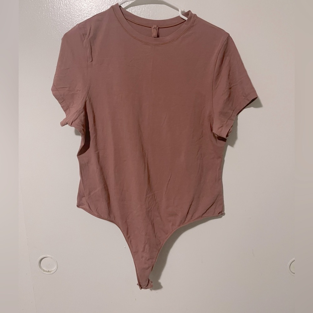 SKIMS bodysuit dusty pink